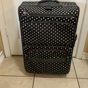 black and white polka dot suitcase.